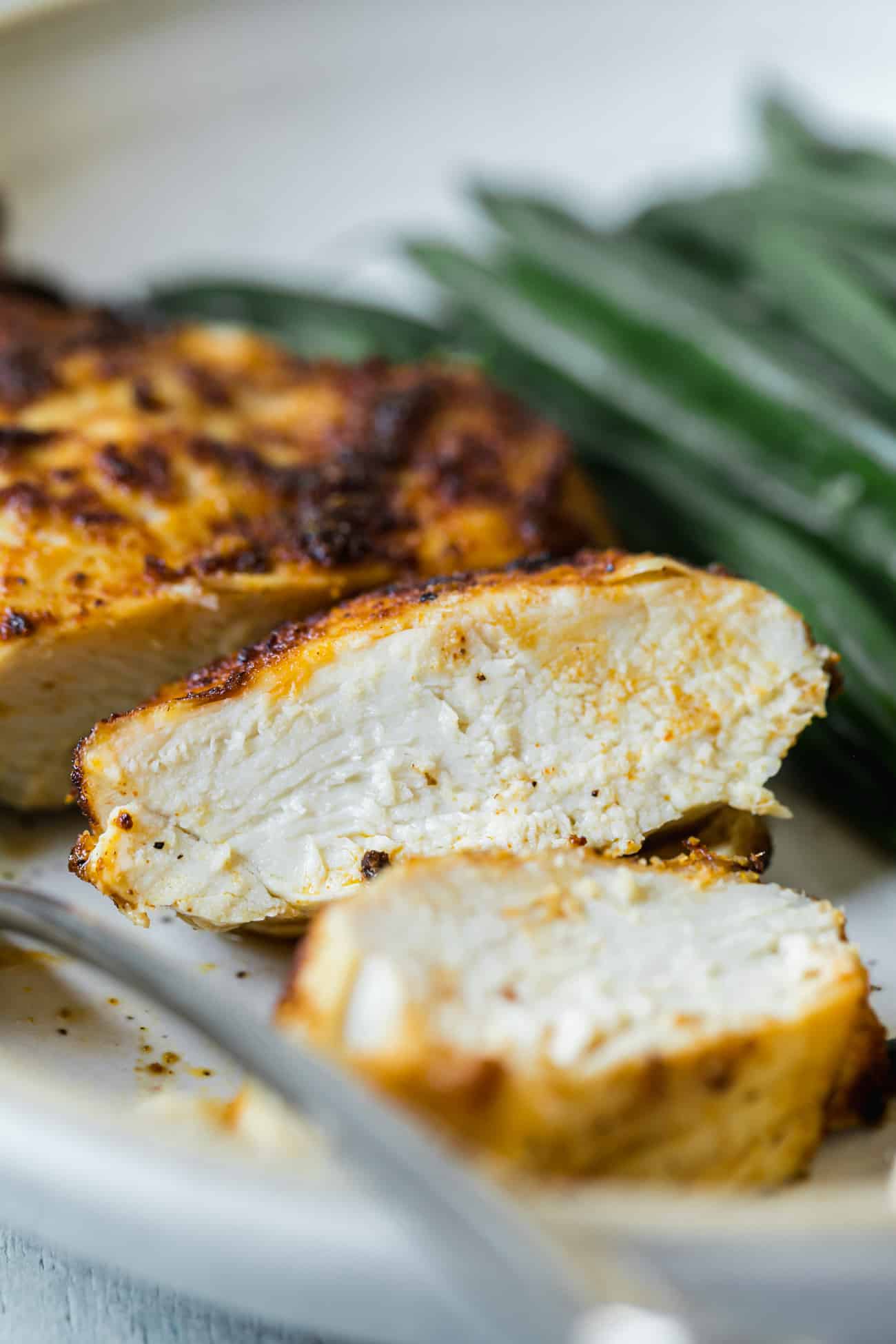 cut open and inside of an air fryer chicken breast on a plate