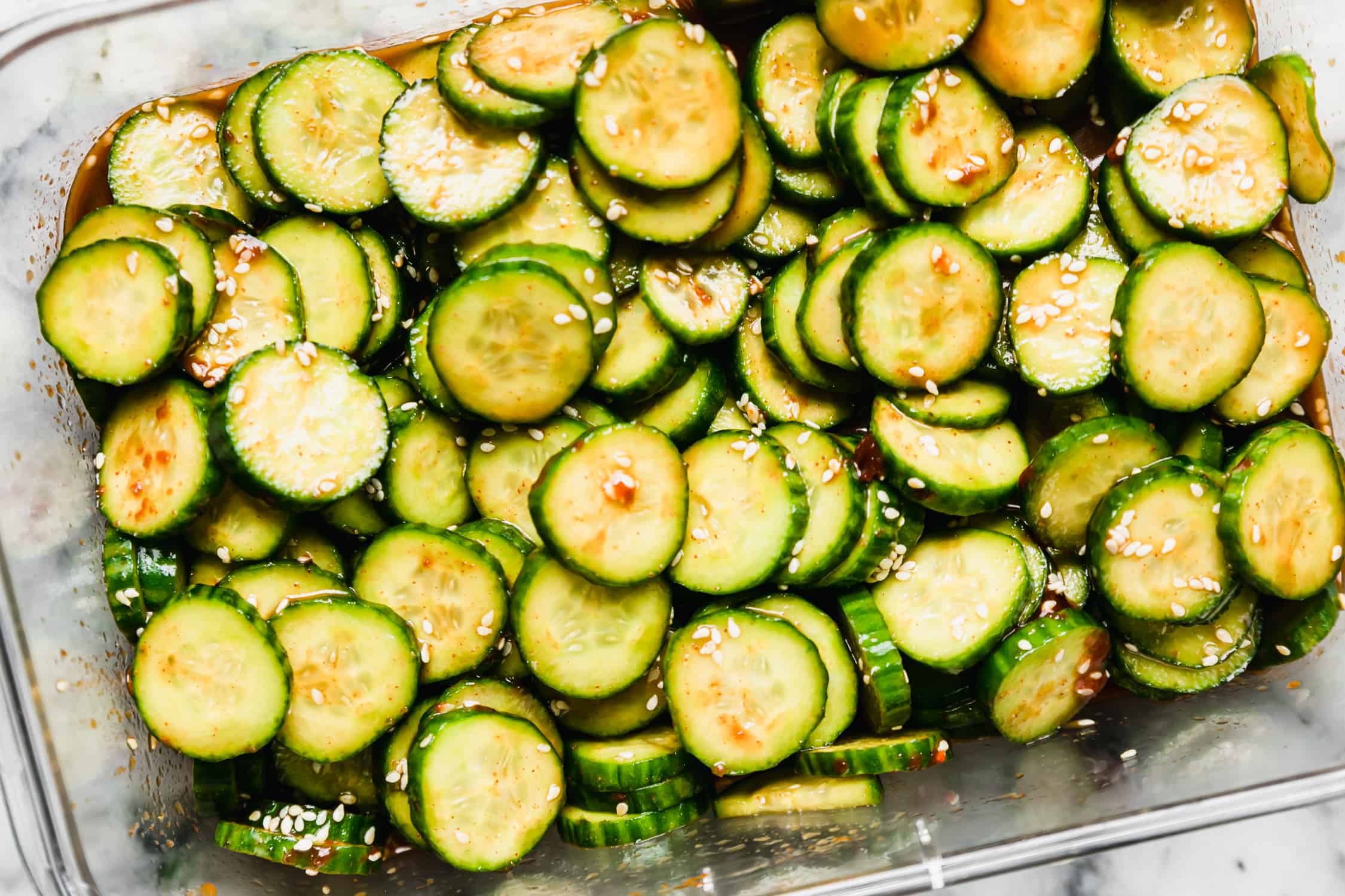 Korean cucumber salad in a large rectangular container